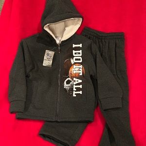 Black sweatsuit size 2T with sports ball theme